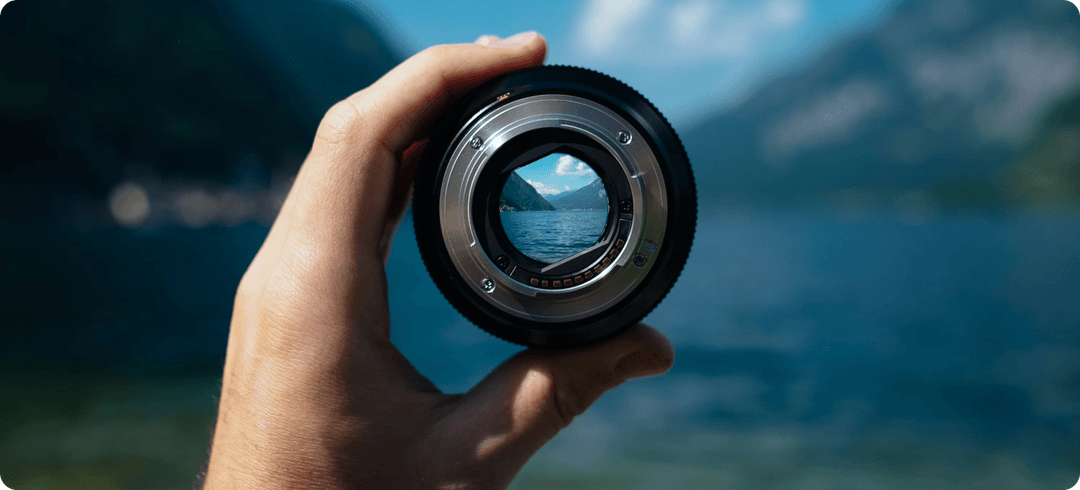 Vision - Hand holding lens